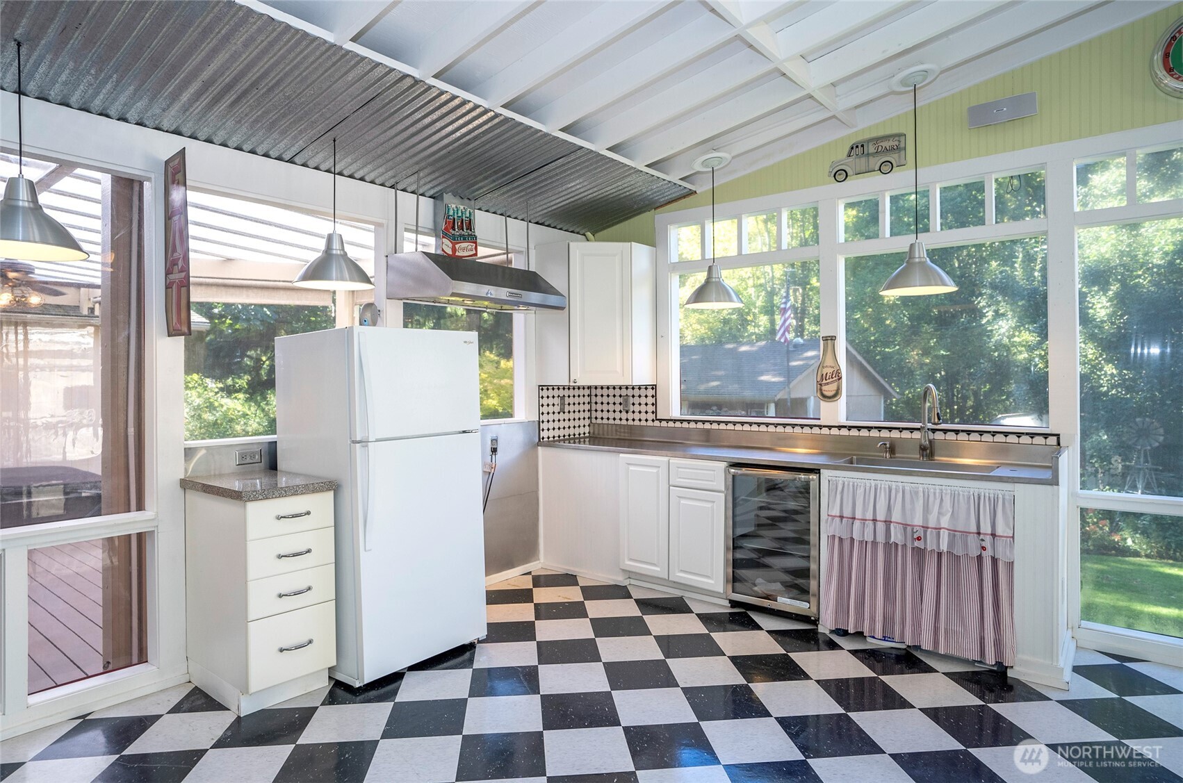 33507 43rd Avenue Southwest Federal Way, WA 98023 - Photo 23 of 40 a kitchen with a checkered floor and white cabinets