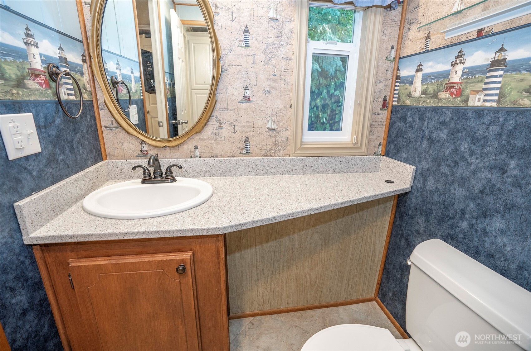 33507 43rd Avenue Southwest Federal Way, WA 98023 - Photo 32 of 40 a bathroom with a sink and a mirror