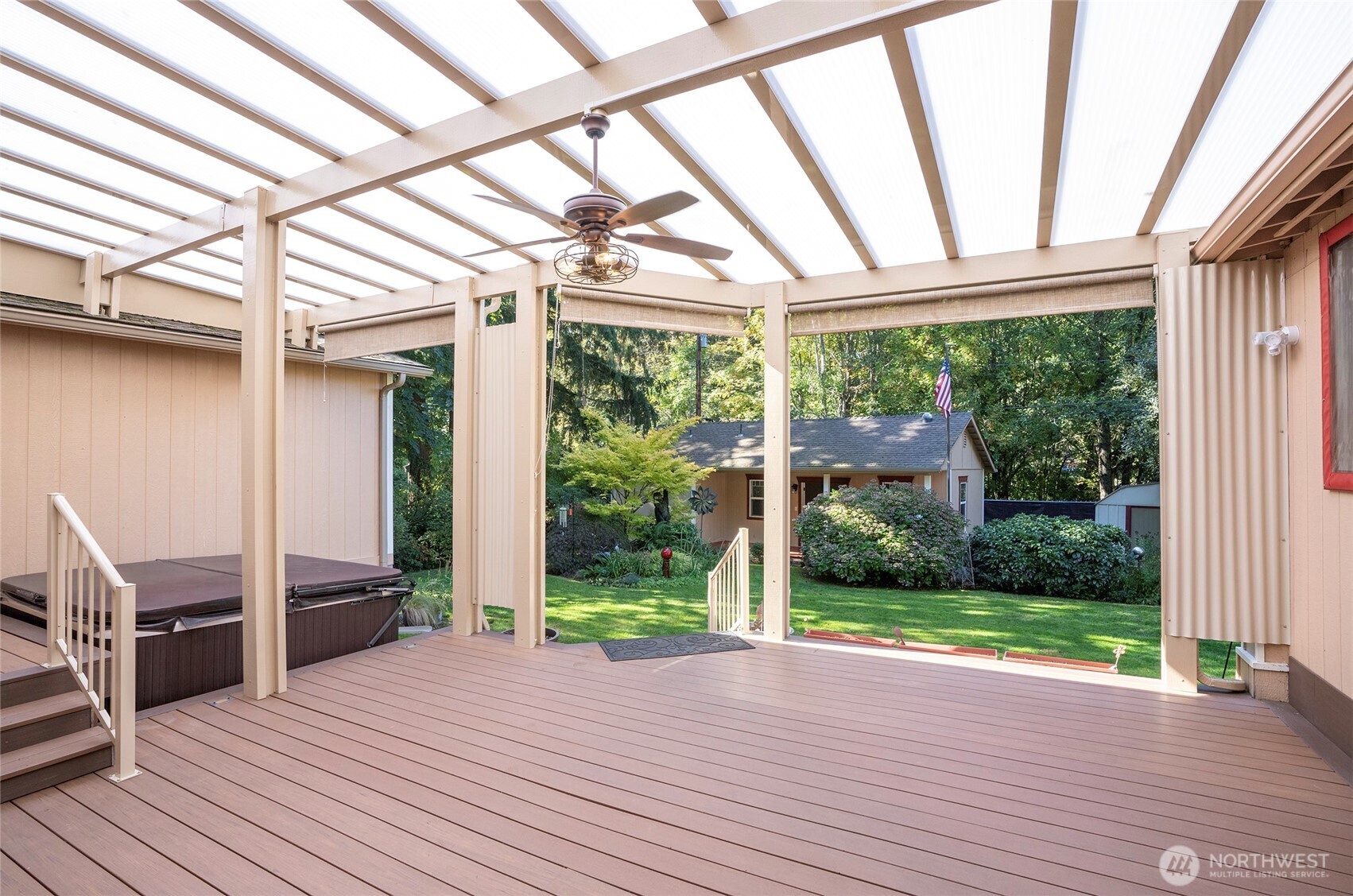 33507 43rd Avenue Southwest Federal Way, WA 98023 - Photo 5 of 40 a view of a porch with wooden floor and roof with a garden view