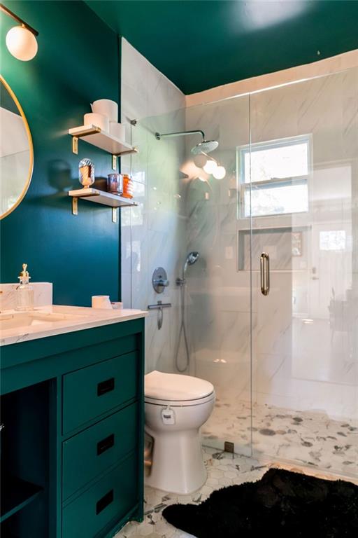 607 Quillian Avenue Decatur, GA 30032 - Photo 11 of 19 a bathroom with a sink a toilet and shower