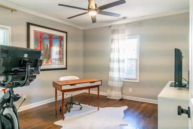 a room with furniture pool table and windows