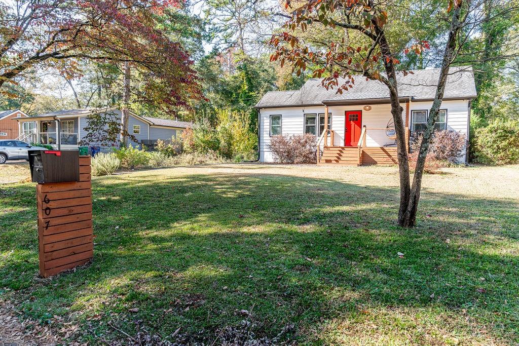 607 Quillian Avenue Decatur, GA 30032 - Photo 19 of 19 a front view of a house with a garden and trees