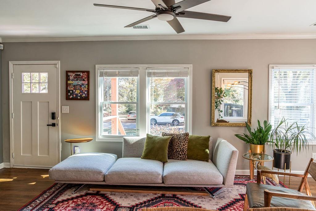 607 Quillian Avenue Decatur, GA 30032 - Photo 5 of 19 a bedroom with a large bed couches and a potted plant