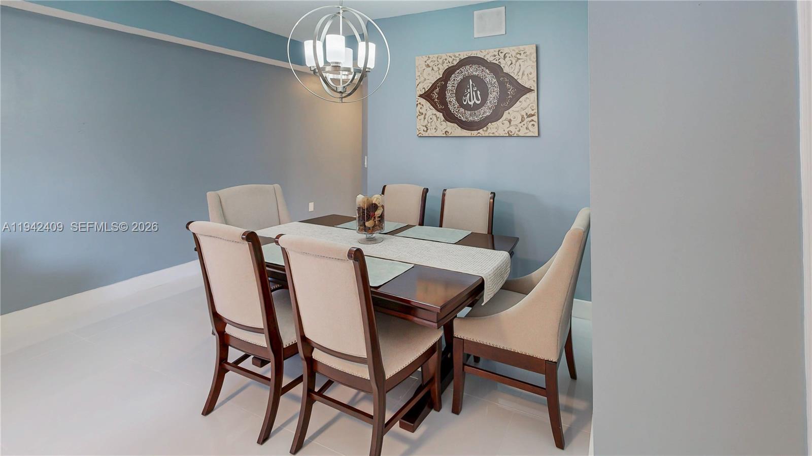 10210 Southwest 154th Place, Unit 1118 Miami, FL 33196 - Photo 13 of 71 a view of a dining room with furniture