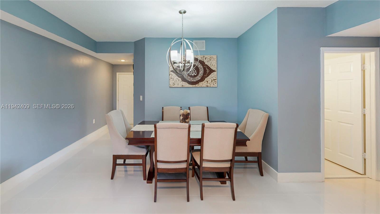 10210 Southwest 154th Place, Unit 1118 Miami, FL 33196 - Photo 14 of 71 a dining room with furniture a chandelier and window