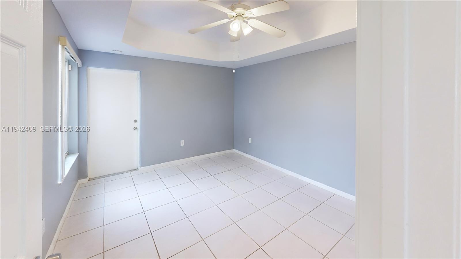 10210 Southwest 154th Place, Unit 1118 Miami, FL 33196 - Photo 15 of 59 a view of an empty room with a window