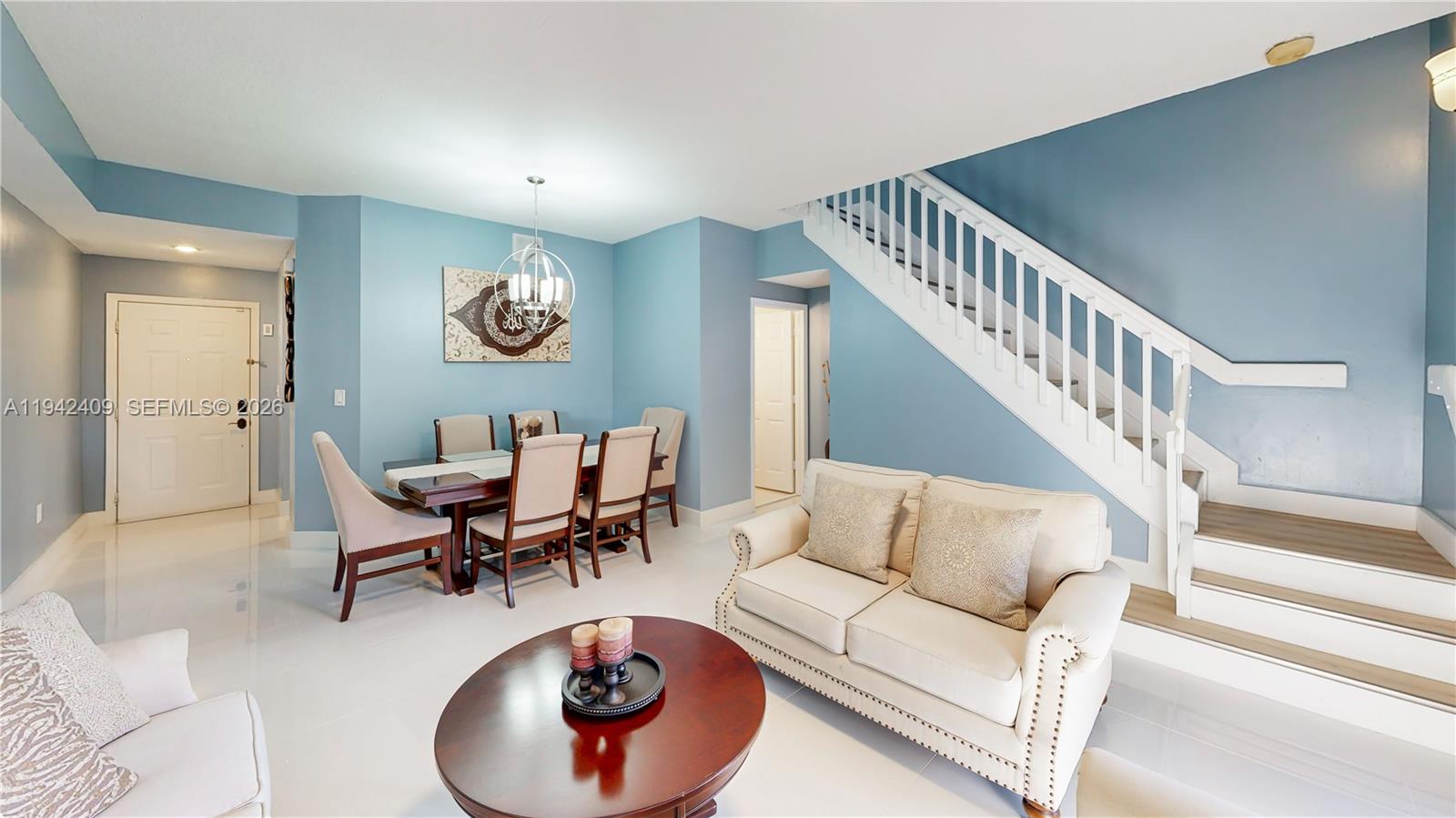10210 Southwest 154th Place, Unit 1118 Miami, FL 33196 - Photo 18 of 59 a living room with furniture and a large window