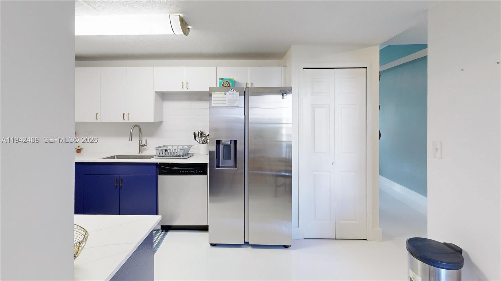 10210 Southwest 154th Place, Unit 1118 Miami, FL 33196 - Photo 19 of 71 a kitchen with a refrigerator and a sink