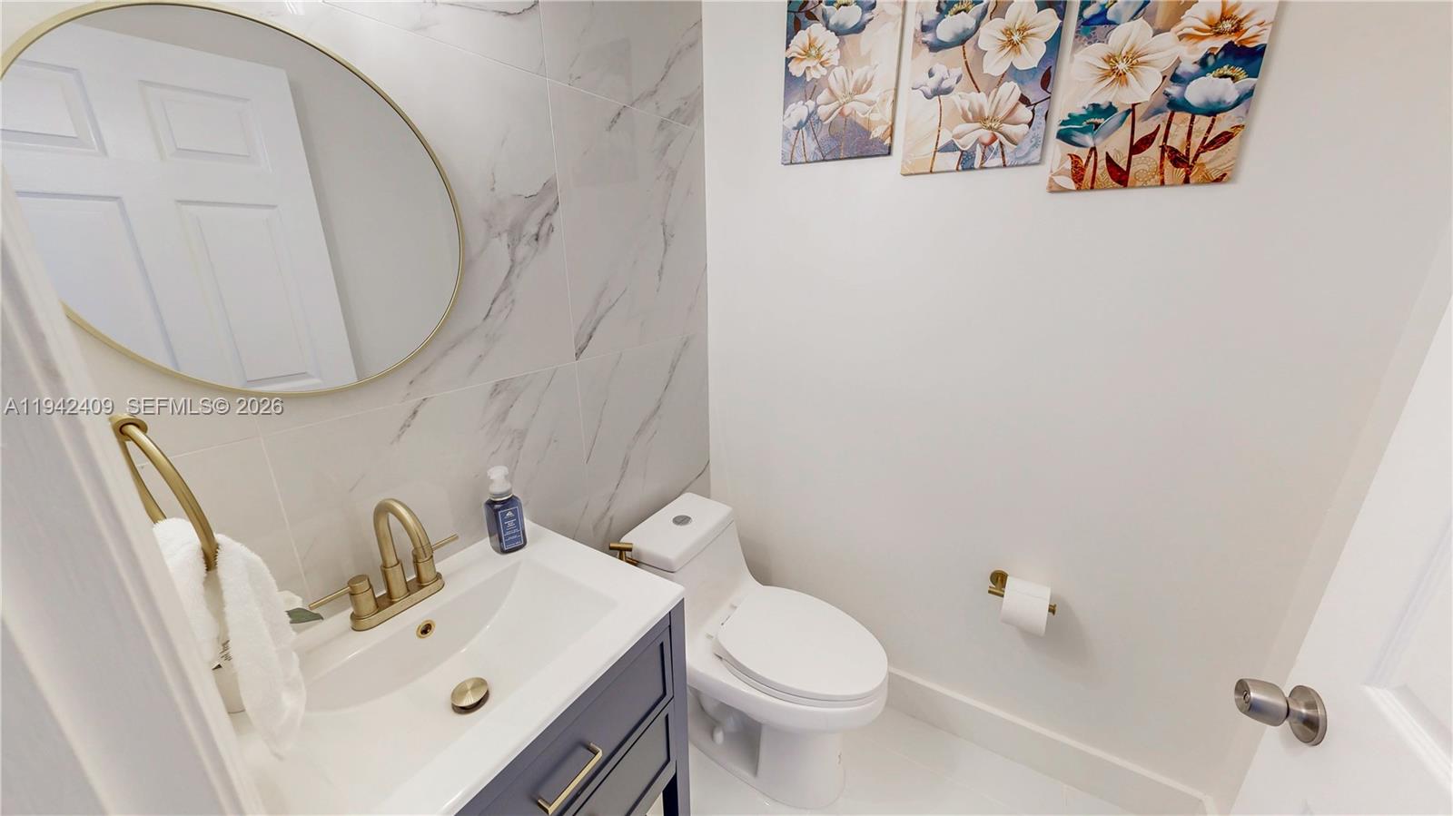 10210 Southwest 154th Place, Unit 1118 Miami, FL 33196 - Photo 20 of 71 a bathroom with a sink and a mirror
