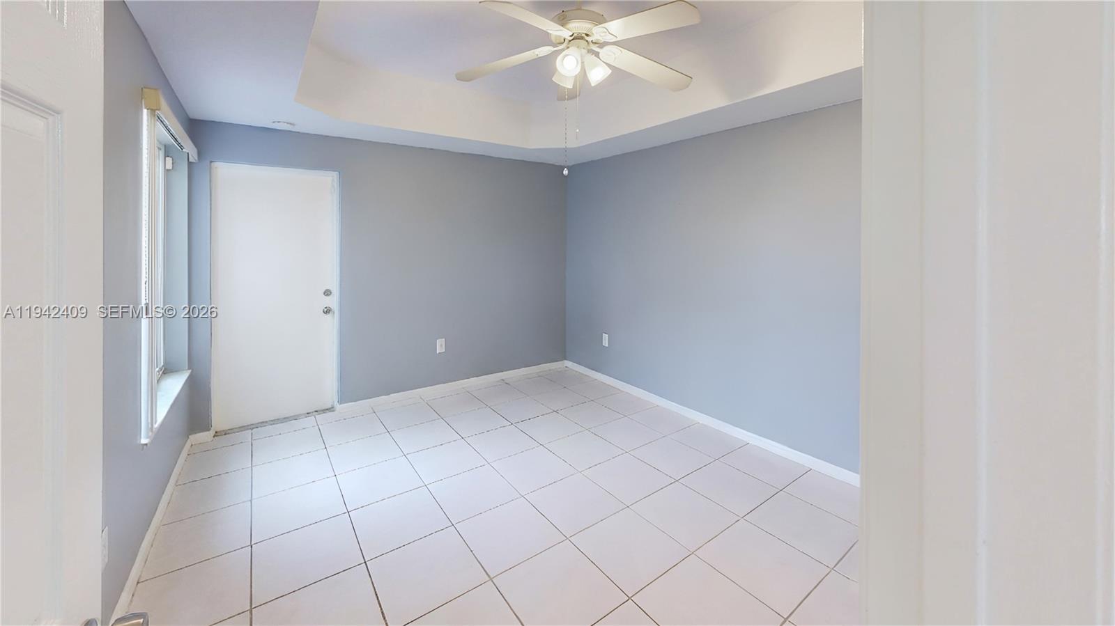10210 Southwest 154th Place, Unit 1118 Miami, FL 33196 - Photo 21 of 71 a view of an empty room with a window