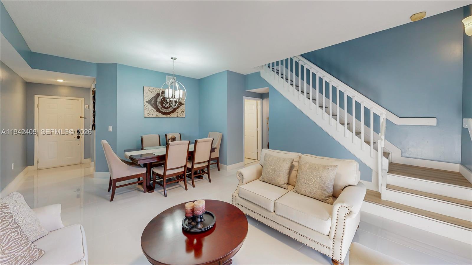 10210 Southwest 154th Place, Unit 1118 Miami, FL 33196 - Photo 24 of 71 a living room with furniture and a rug