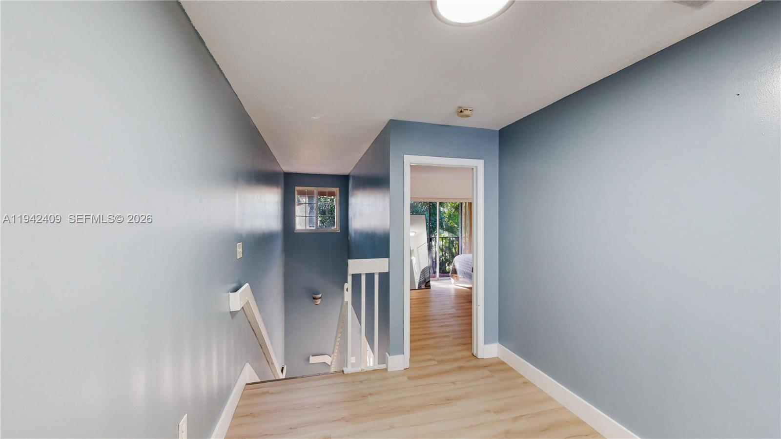 10210 Southwest 154th Place, Unit 1118 Miami, FL 33196 - Photo 26 of 71 a view of entryway and hall with wooden floor