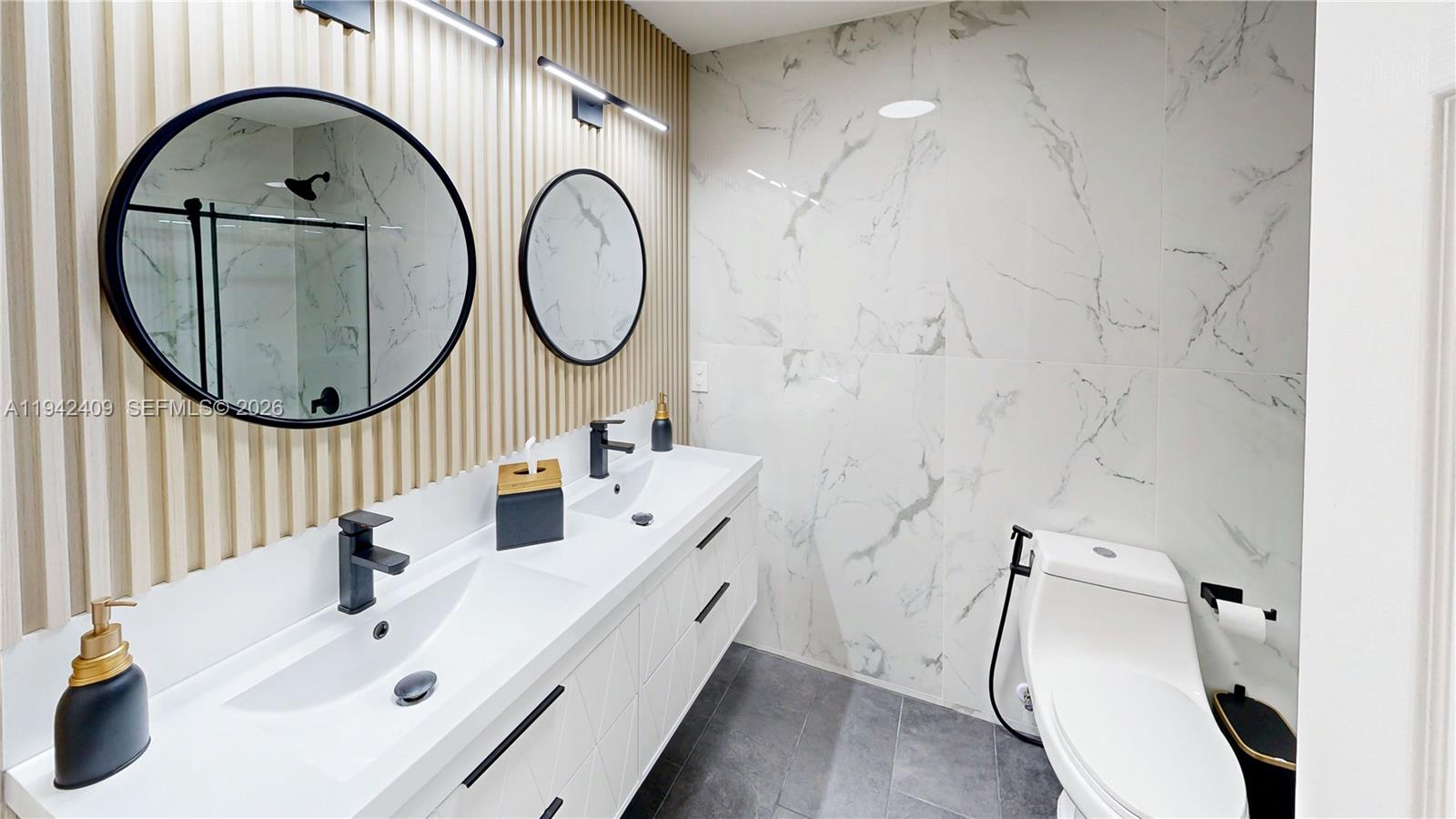 10210 Southwest 154th Place, Unit 1118 Miami, FL 33196 - Photo 27 of 59 a bathroom with a sink and a mirror