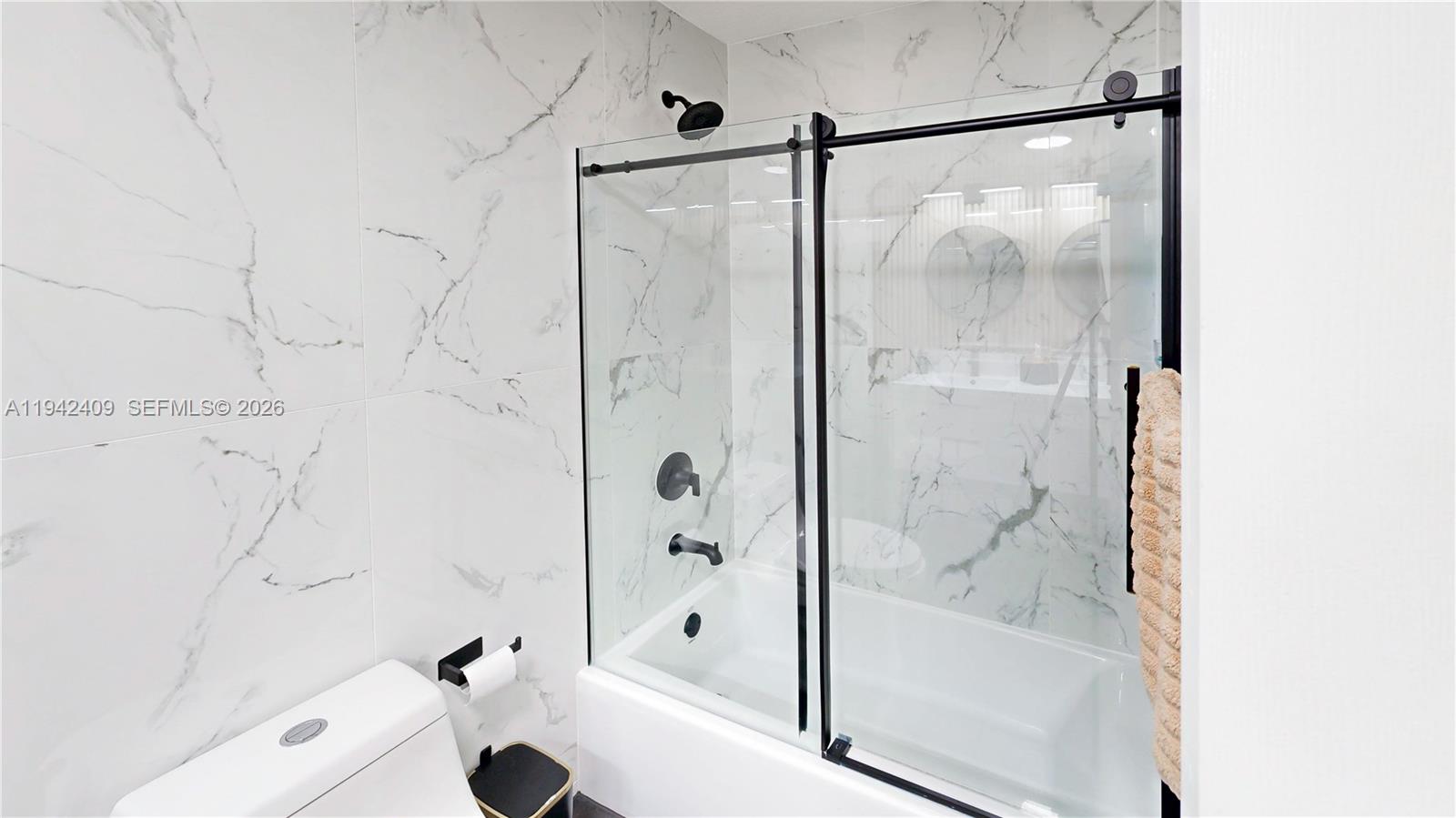 10210 Southwest 154th Place, Unit 1118 Miami, FL 33196 - Photo 28 of 59 a bathroom with a bathtub and a shower