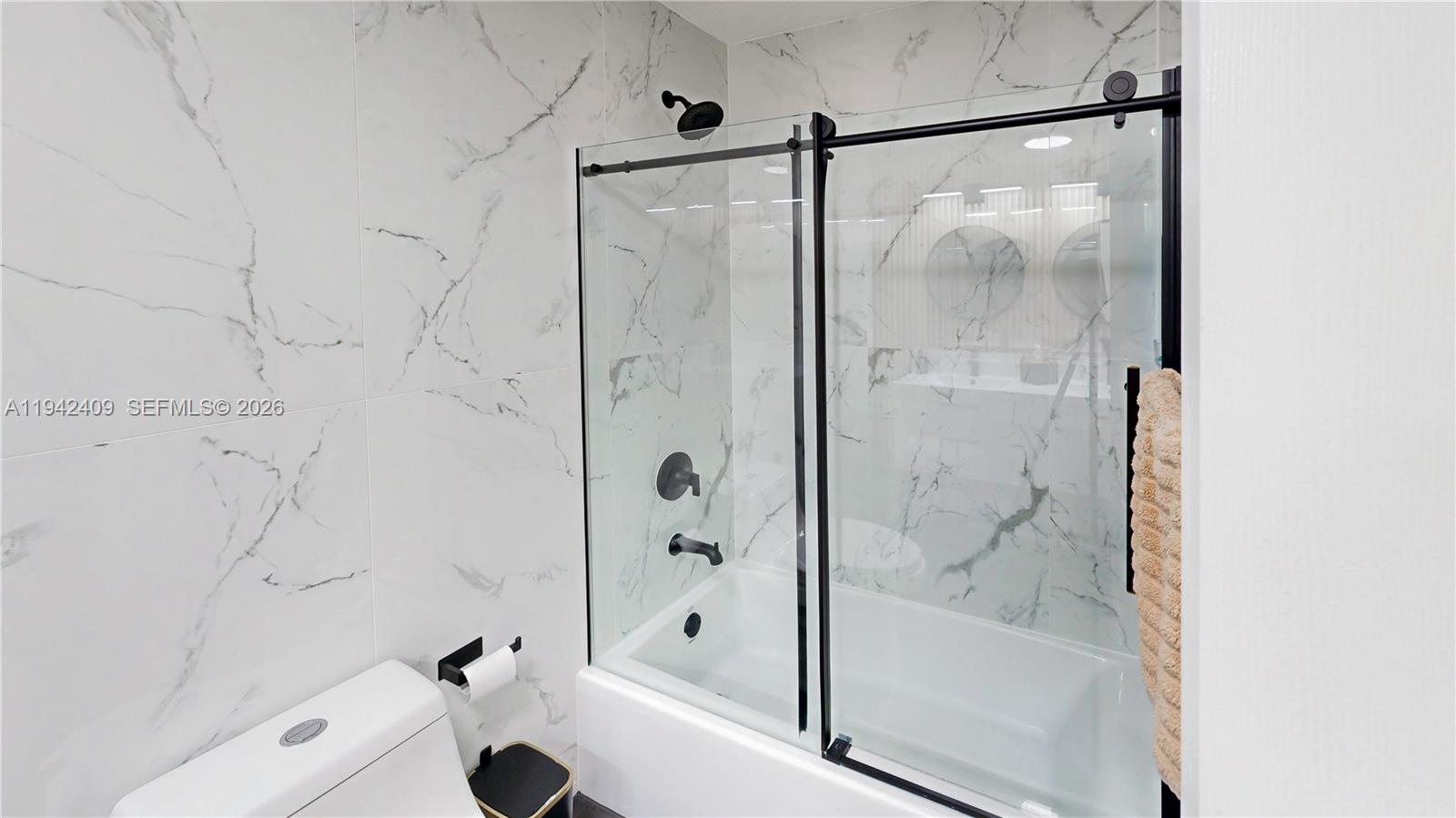 10210 Southwest 154th Place, Unit 1118 Miami, FL 33196 - Photo 34 of 71 a bathroom with a bathtub and a shower