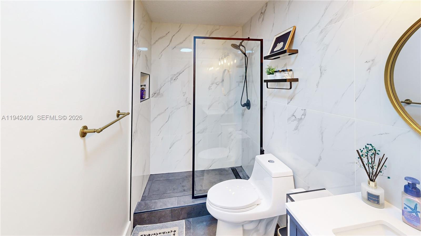 10210 Southwest 154th Place, Unit 1118 Miami, FL 33196 - Photo 37 of 59 a bathroom with a sink toilet and shower