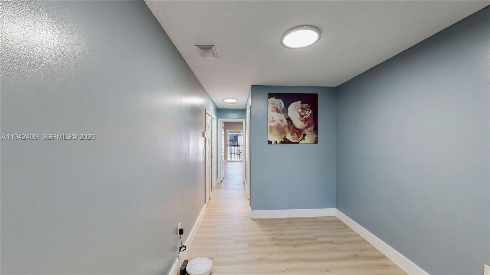 10210 Southwest 154th Place, Unit 1118 Miami, FL 33196 - Photo 37 of 71 a view of hallway with wooden floor