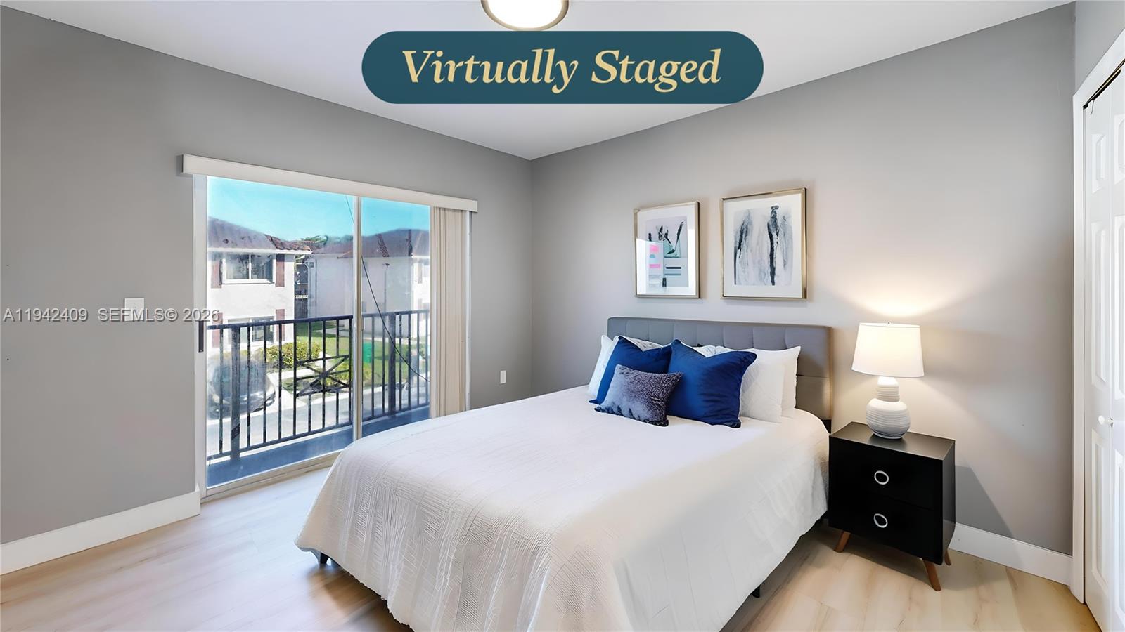 10210 Southwest 154th Place, Unit 1118 Miami, FL 33196 - Photo 39 of 59 a bedroom with a bed and a large window