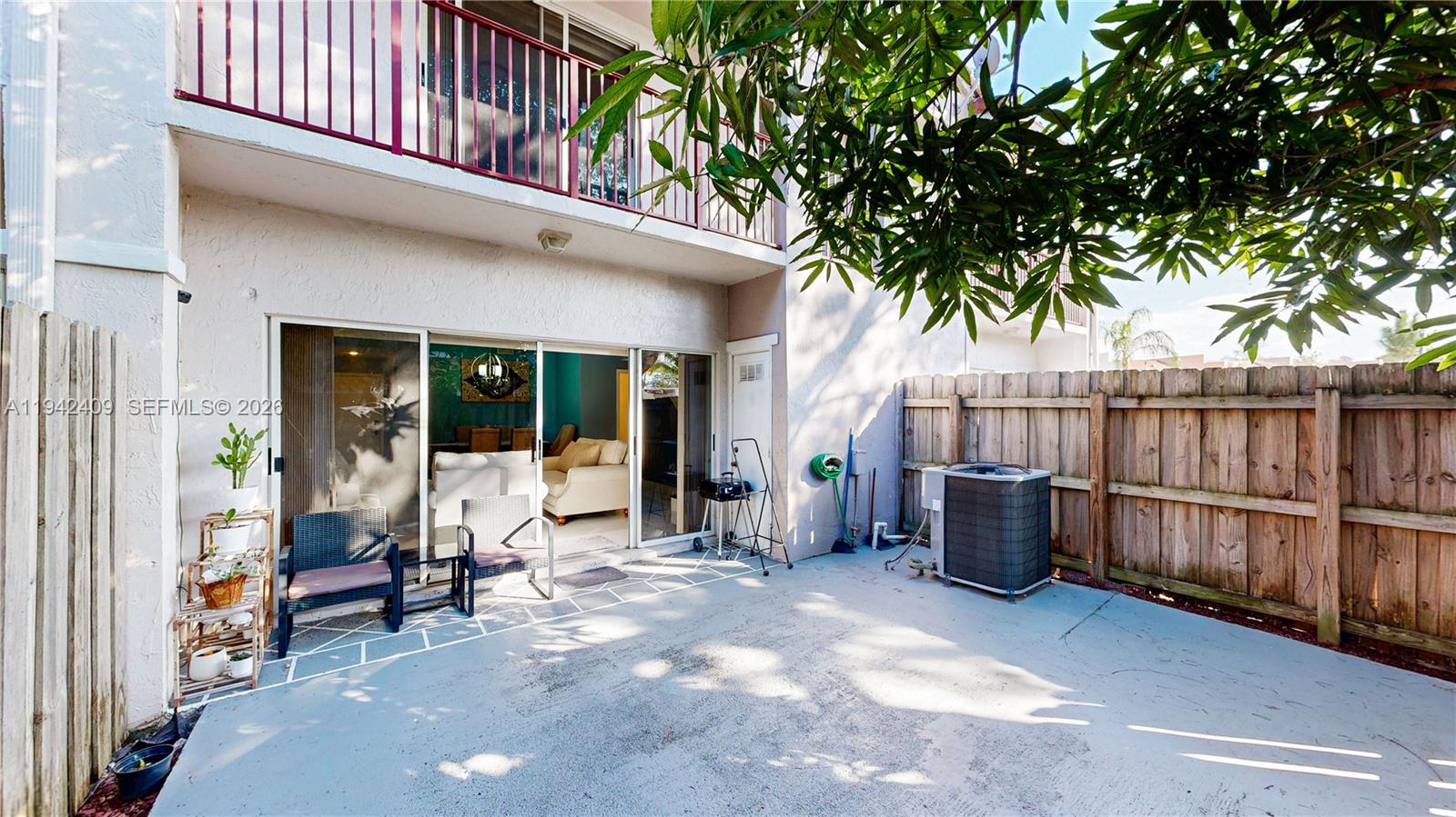 10210 Southwest 154th Place, Unit 1118 Miami, FL 33196 - Photo 42 of 59 a view of a house with backyard and sitting area