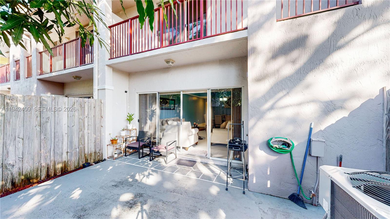 10210 Southwest 154th Place, Unit 1118 Miami, FL 33196 - Photo 43 of 59 a view of a house with backyard stove and sitting area