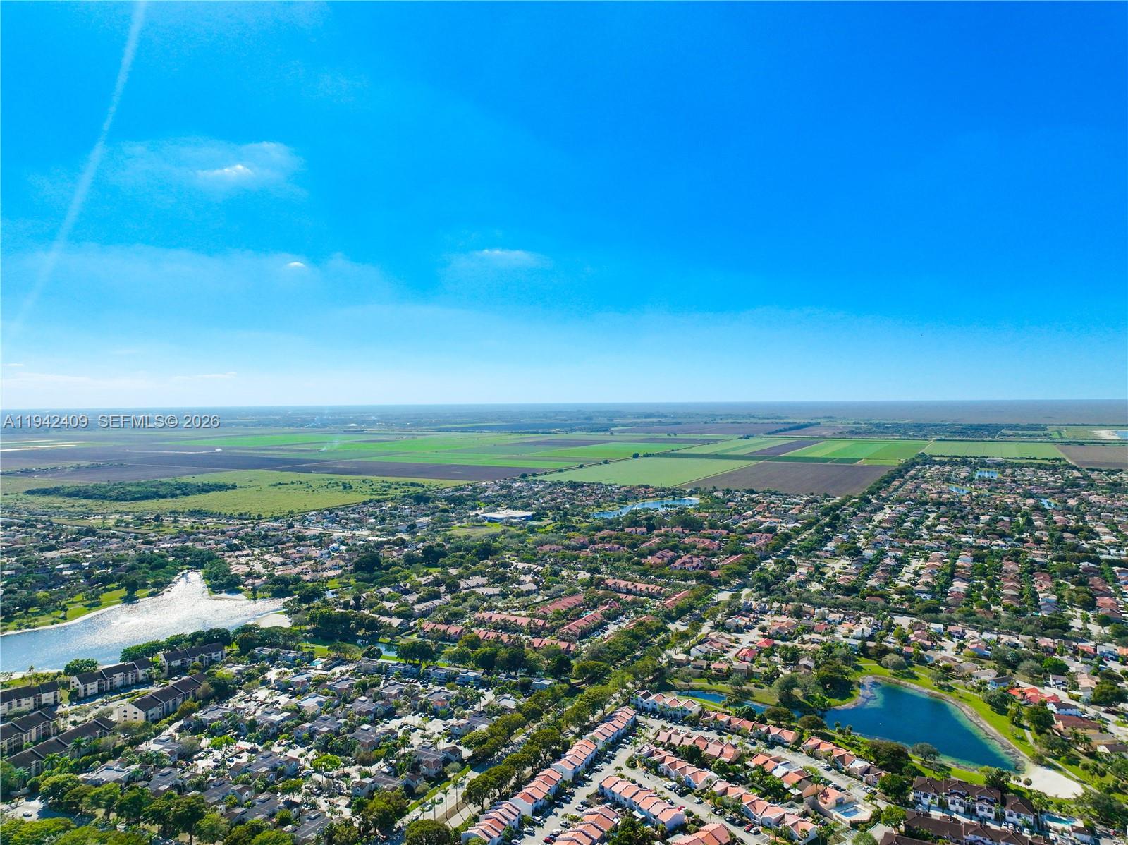 10210 Southwest 154th Place, Unit 1118 Miami, FL 33196 - Photo 59 of 59 an aerial view of residential building and ocean