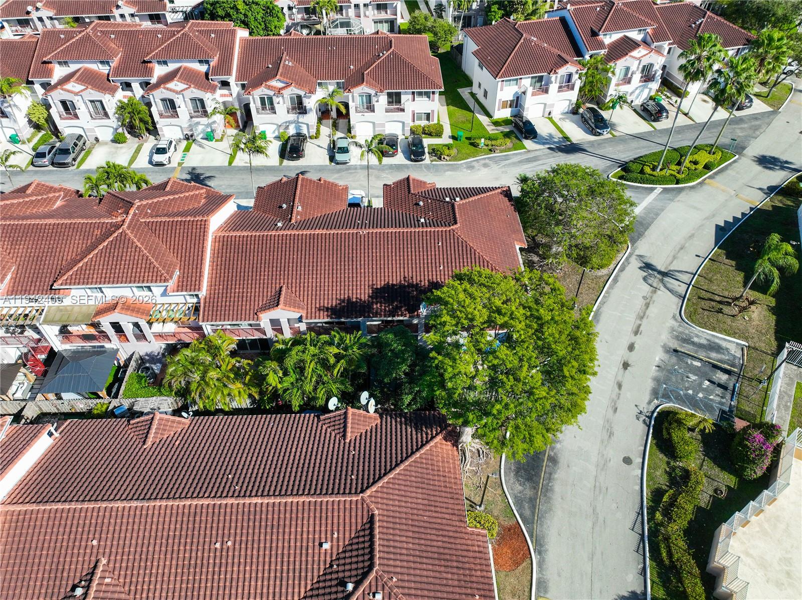 10210 Southwest 154th Place, Unit 1118 Miami, FL 33196 - Photo 65 of 71 an aerial view of residential houses and outdoor space