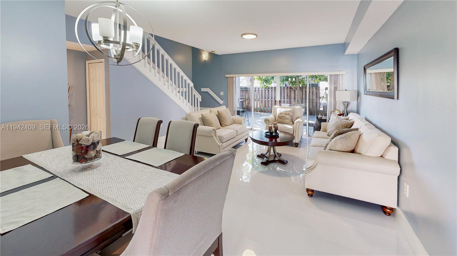 10210 Southwest 154th Place, Unit 1118 Miami, FL 33196 - Photo 9 of 71 a living room with furniture and a table