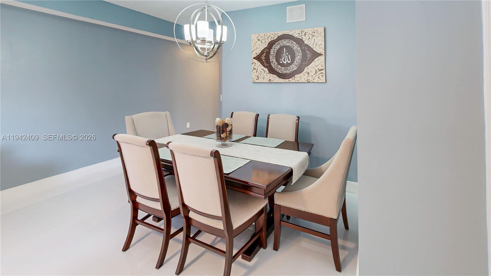 10210 Southwest 154th Place, Unit 1118 Miami, FL 33196 - Photo 10 of 59 a view of a dining room with furniture