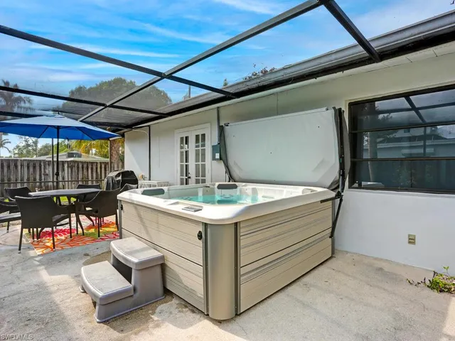 a view of a lounge chair and table in the patio