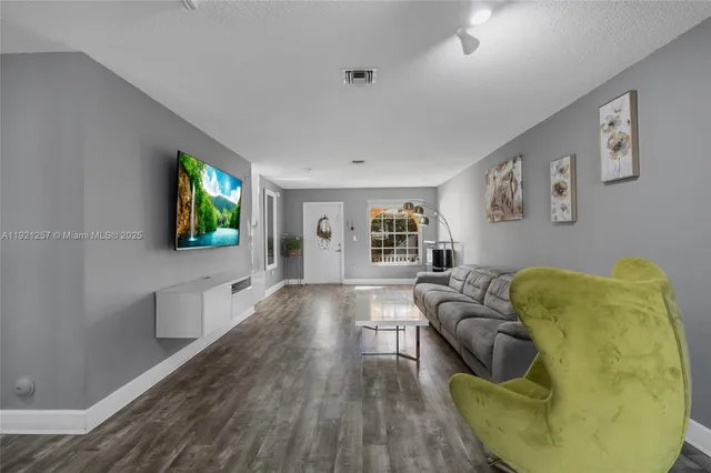 a kitchen with granite countertop a sink and a counter top space