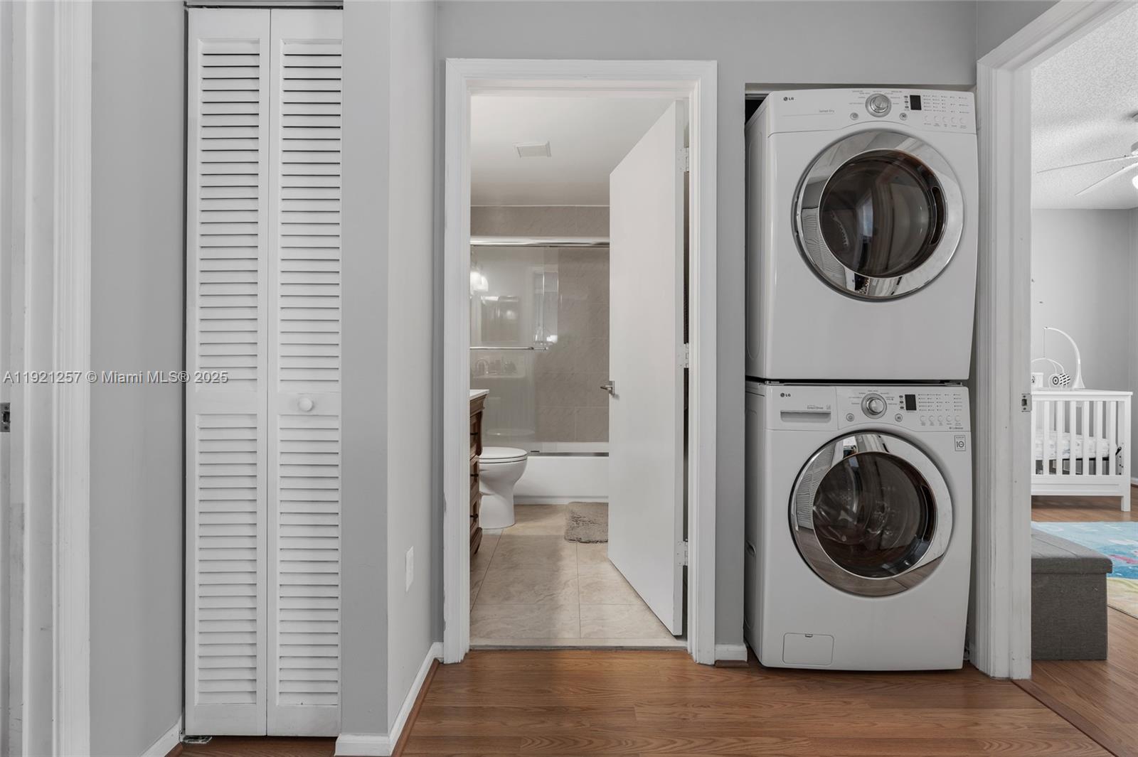 4055 Eastridge Drive Deerfield Beach, FL 33064 - Photo 25 of 56 a utility room with sink dryer and washer