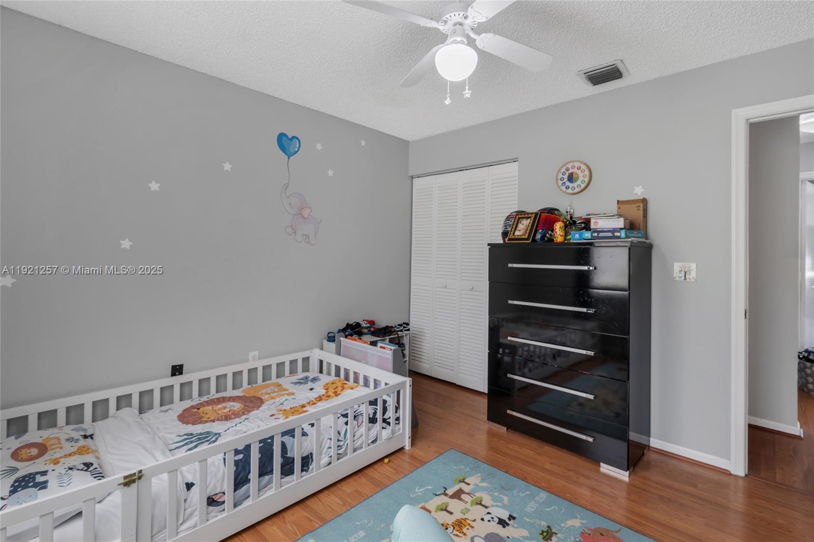 4055 Eastridge Drive Deerfield Beach, FL 33064 - Photo 28 of 56 a bedroom with furniture and a baby crib