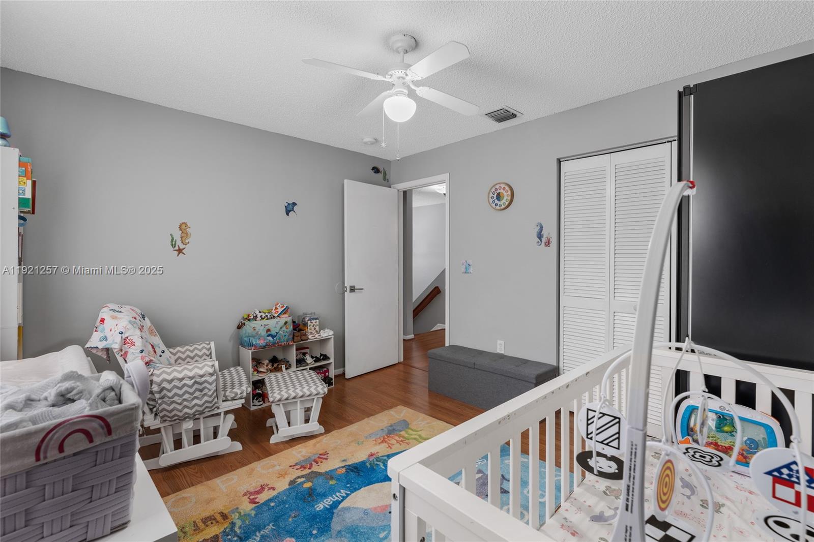 4055 Eastridge Drive Deerfield Beach, FL 33064 - Photo 30 of 56 a living room with furniture and a flat screen tv