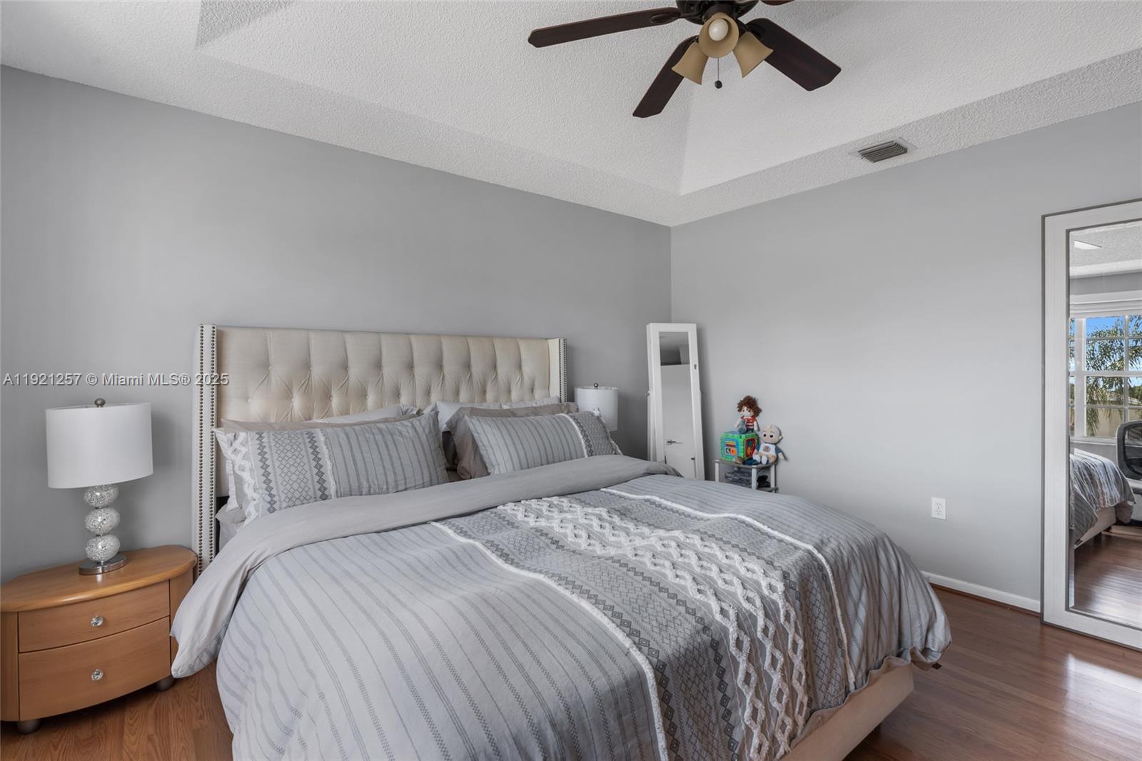 4055 Eastridge Drive Deerfield Beach, FL 33064 - Photo 33 of 56 a bedroom with a bed and window