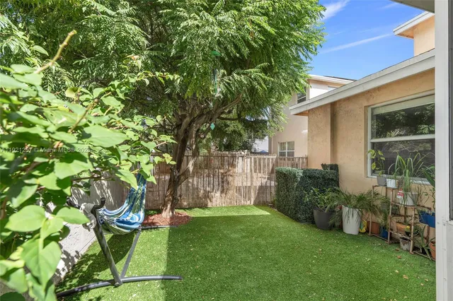 a view of a back yard of the house