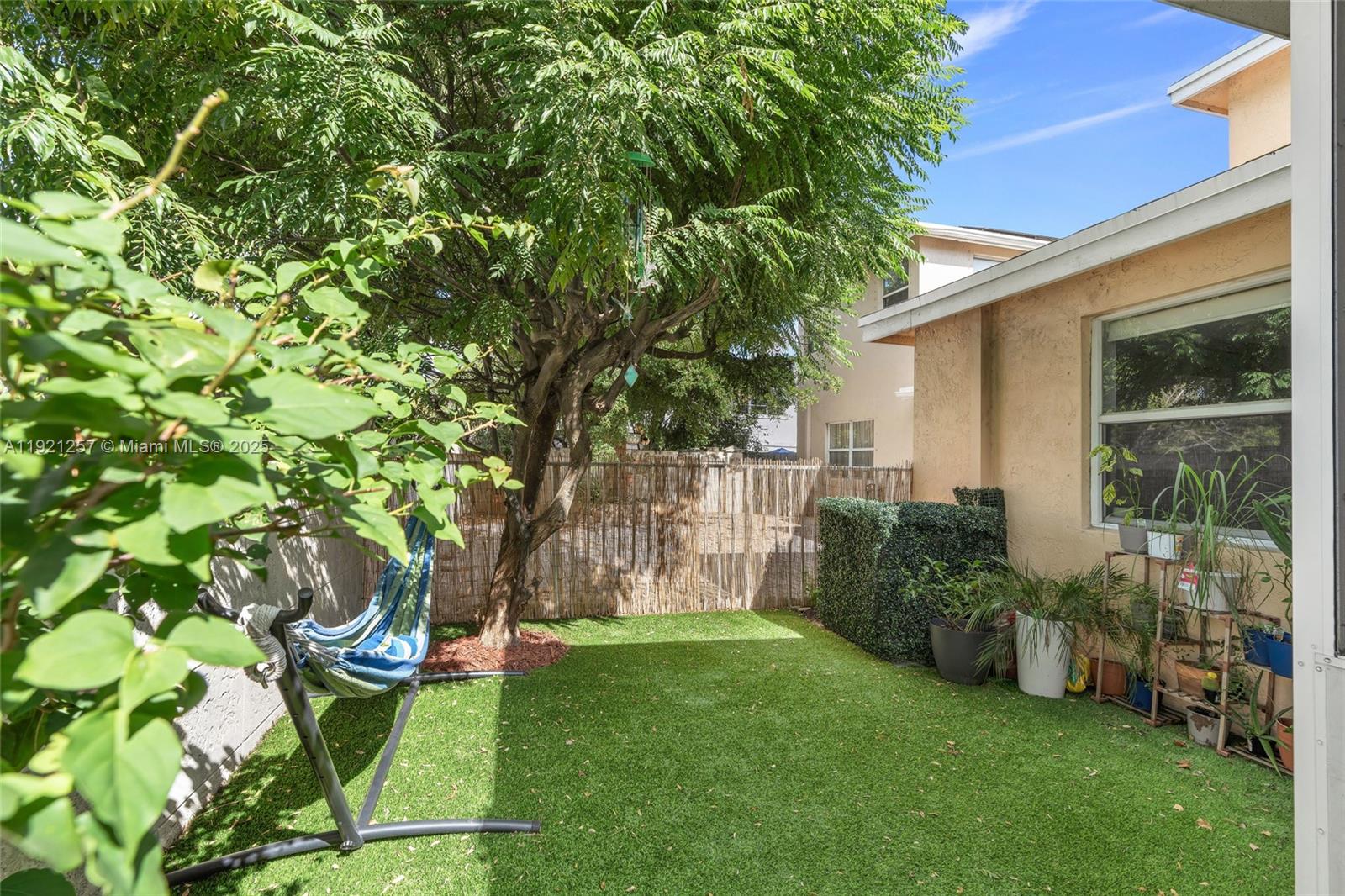 4055 Eastridge Drive Deerfield Beach, FL 33064 - Photo 41 of 56 a garden view with a seating space