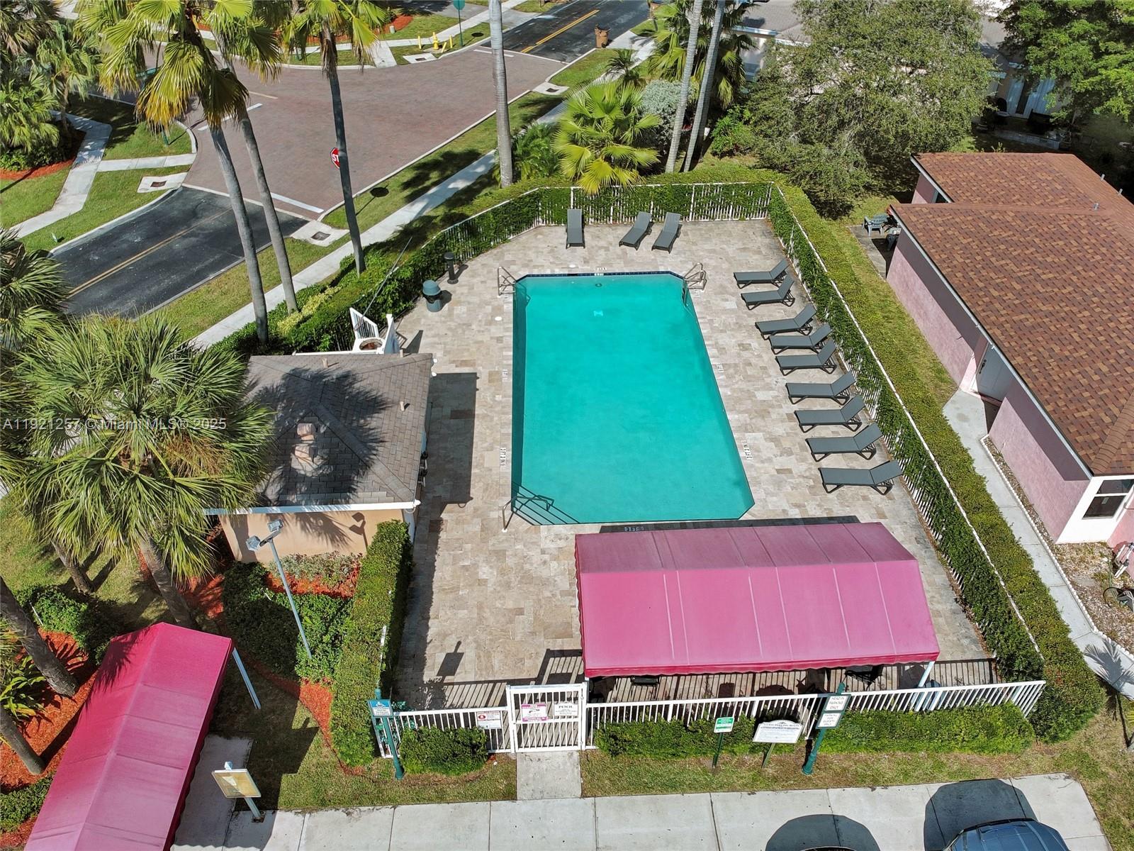 4055 Eastridge Drive Deerfield Beach, FL 33064 - Photo 50 of 56 an aerial view of a yard
