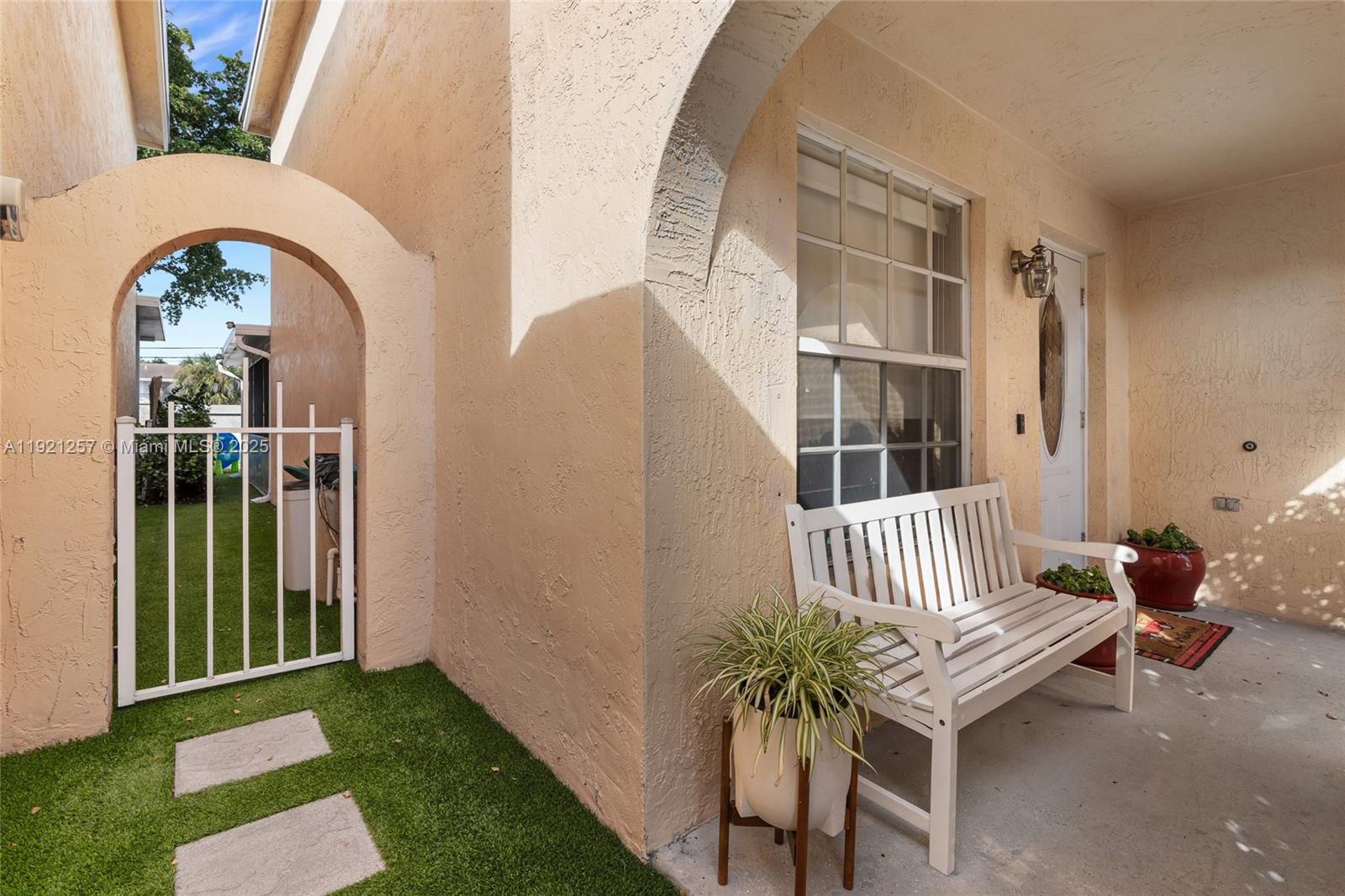 4055 Eastridge Drive Deerfield Beach, FL 33064 - Photo 6 of 56 a view of entryway with garden