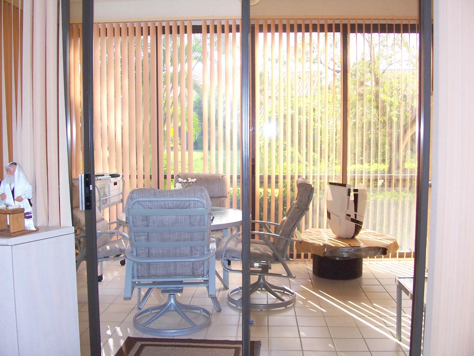 7908 Seville Place, Unit 1701 Boca Raton, FL 33433 - Photo 7 of 23 View of glassed terrace from living room