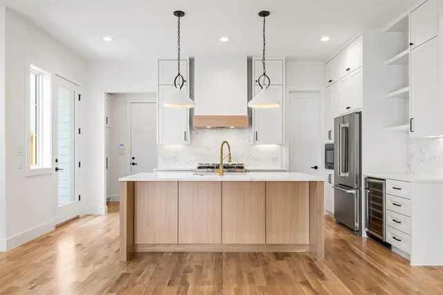 a kitchen with a sink and refrigerator