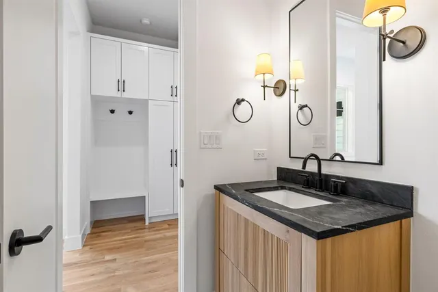 a very nice looking room with wooden floor and furniture