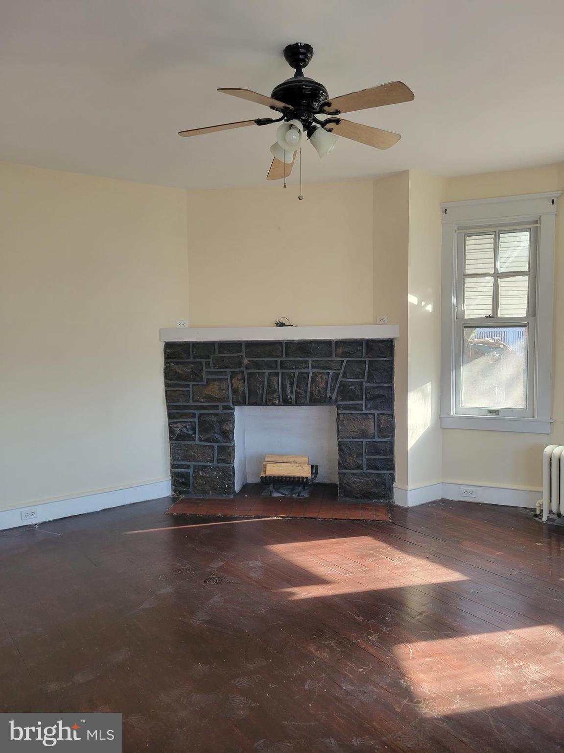 1517 North 13th Street Reading, PA 19604 - Photo 5 of 18 a living room with furniture and a fireplace