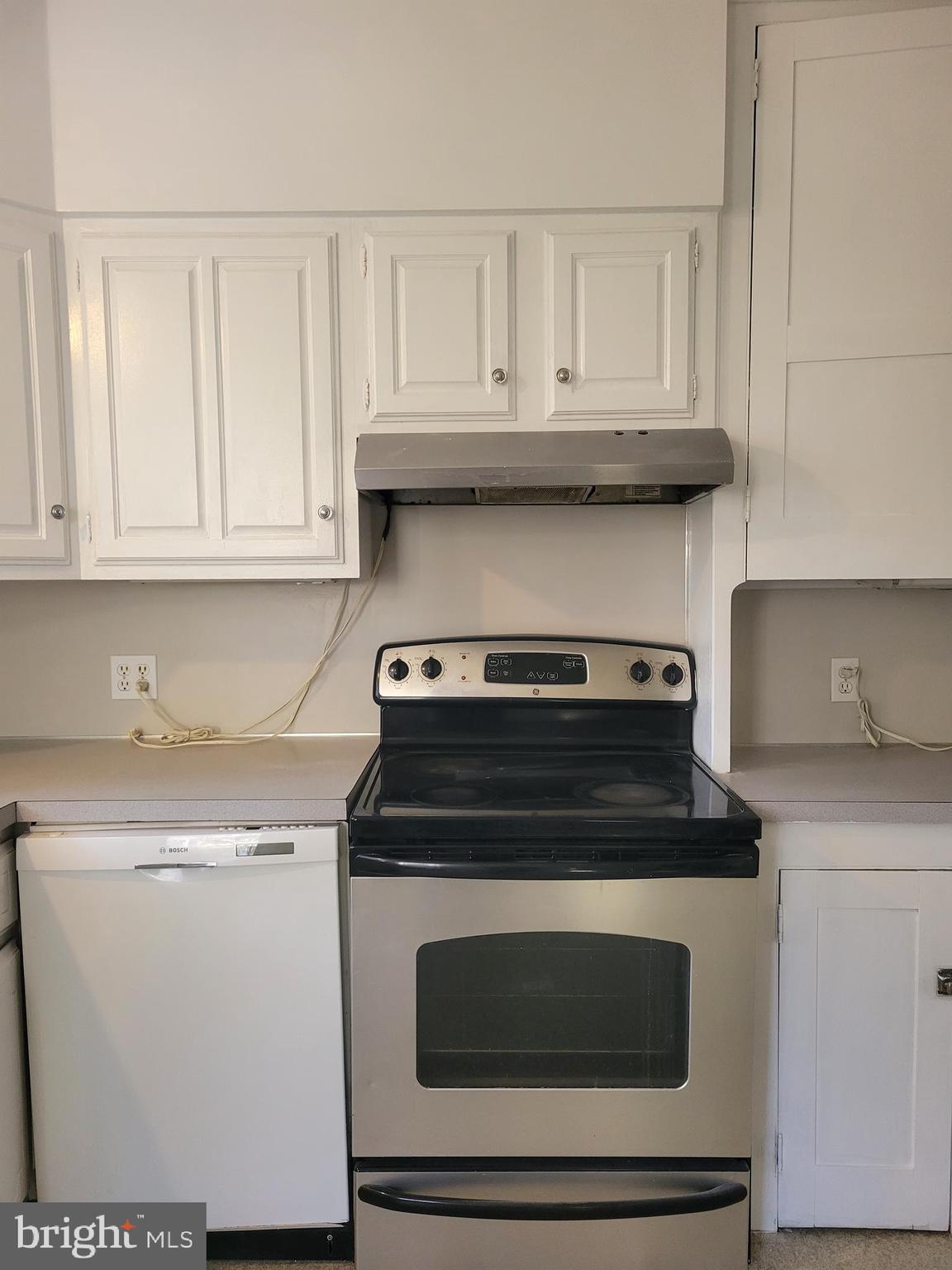 1517 North 13th Street Reading, PA 19604 - Photo 8 of 18 a stove top oven sitting inside of a kitchen