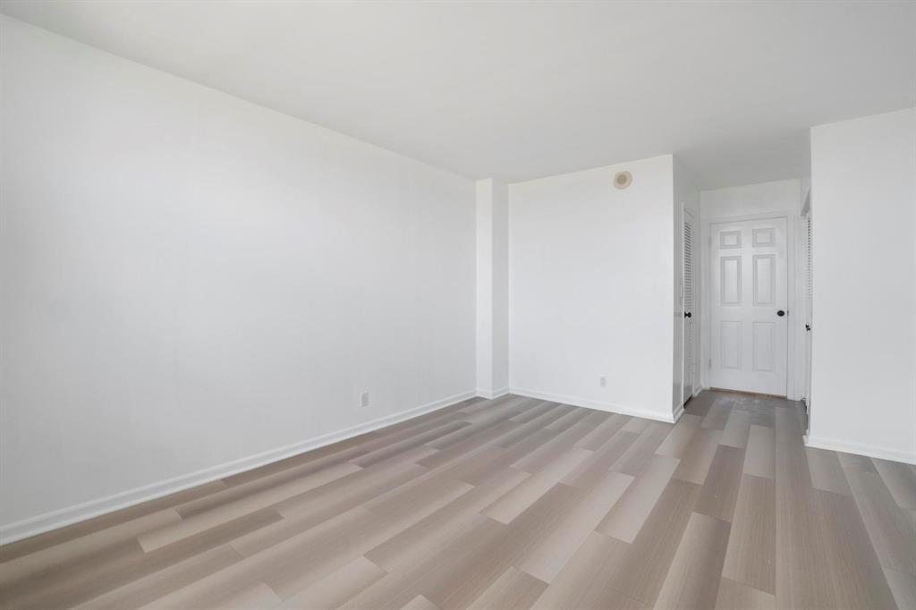 1625 Southeast 10th Avenue, Unit 508 Fort Lauderdale, FL 33316 - Photo 12 of 22 a view of an empty room with wooden floor