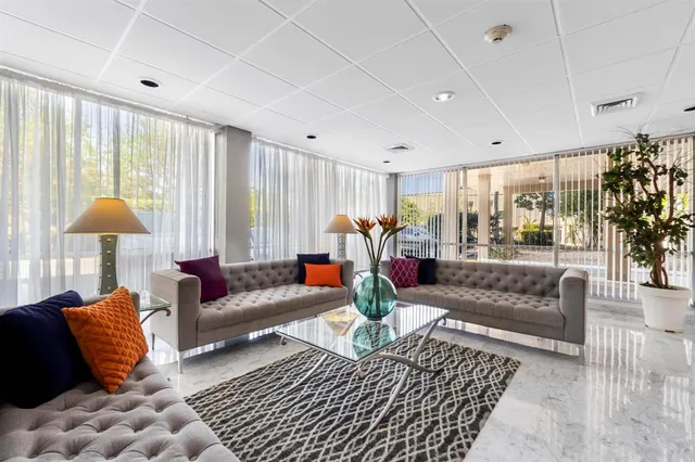 an aerial view of a house with a yard and balcony