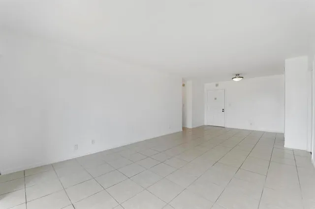 a kitchen with stainless steel appliances granite countertop a sink stove and microwave