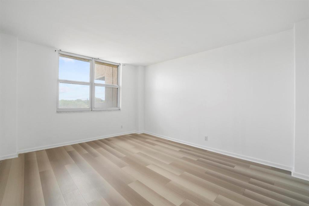 1625 Southeast 10th Avenue, Unit 508 Fort Lauderdale, FL 33316 - Photo 8 of 22 wooden floor in an empty room with a window