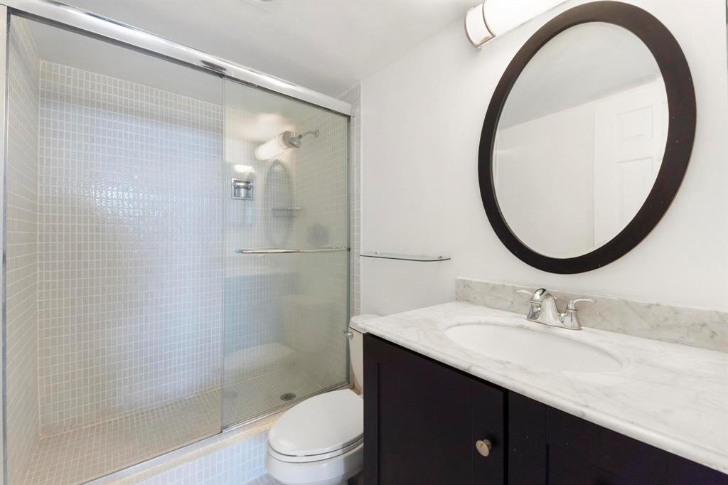 1625 Southeast 10th Avenue, Unit 508 Fort Lauderdale, FL 33316 - Photo 10 of 22 a bathroom with a sink a toilet and a mirror