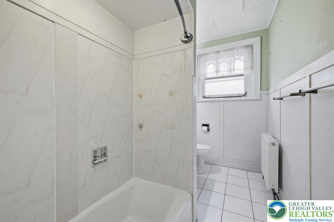 1229 Main Street Northampton, PA 18067 - Photo 19 of 24 a bathroom with a bathtub and a shower