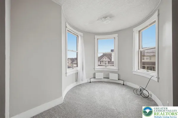 a view of livingroom with furniture and windows